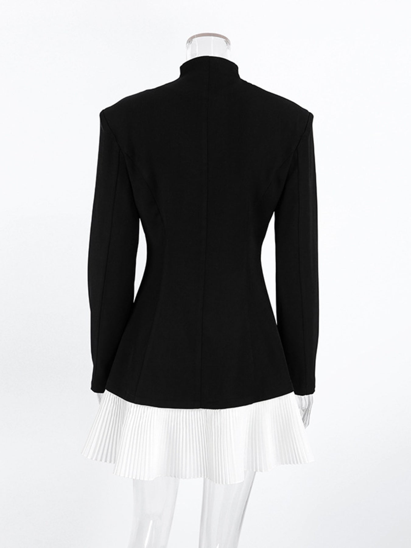 Back view of Pleated One Button Blazer Dress showcasing the tailored black top and pleated white skirt.