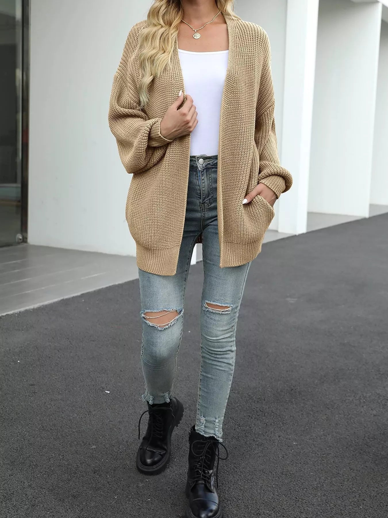 Chunky Knit Open Front Cardigan for Women in cozy beige style, paired with jeans and boots.