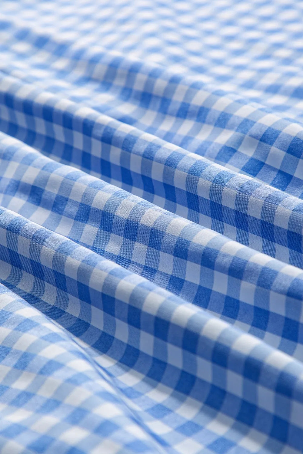 Plaid Button Up Long Sleeve Shirt fabric in blue and white checkered pattern, perfect for casual everyday style.
