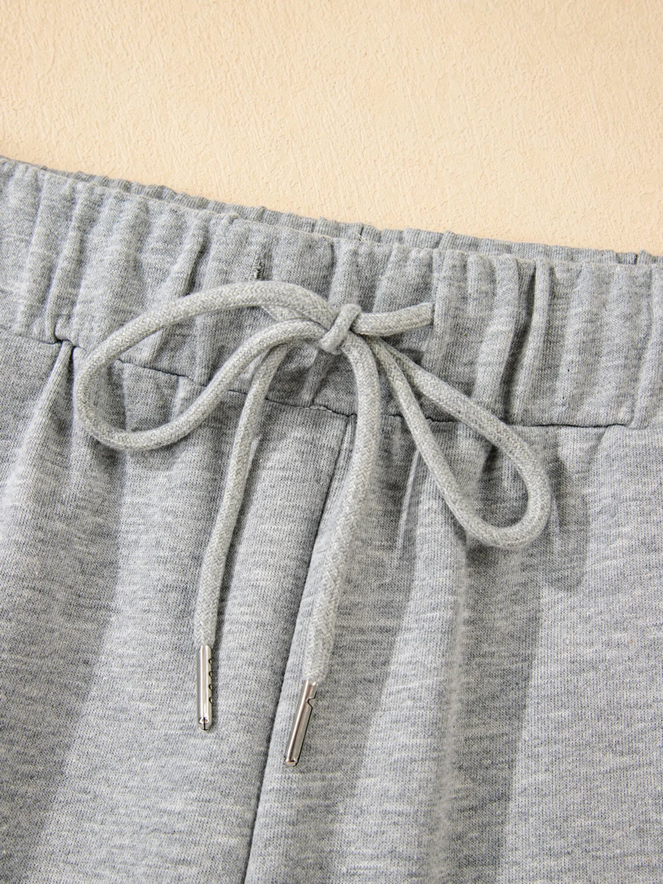 Close-up of drawstring detail on Contrast Trim Round Neck Top and Pants Set, highlighting the slightly stretchy waistband.