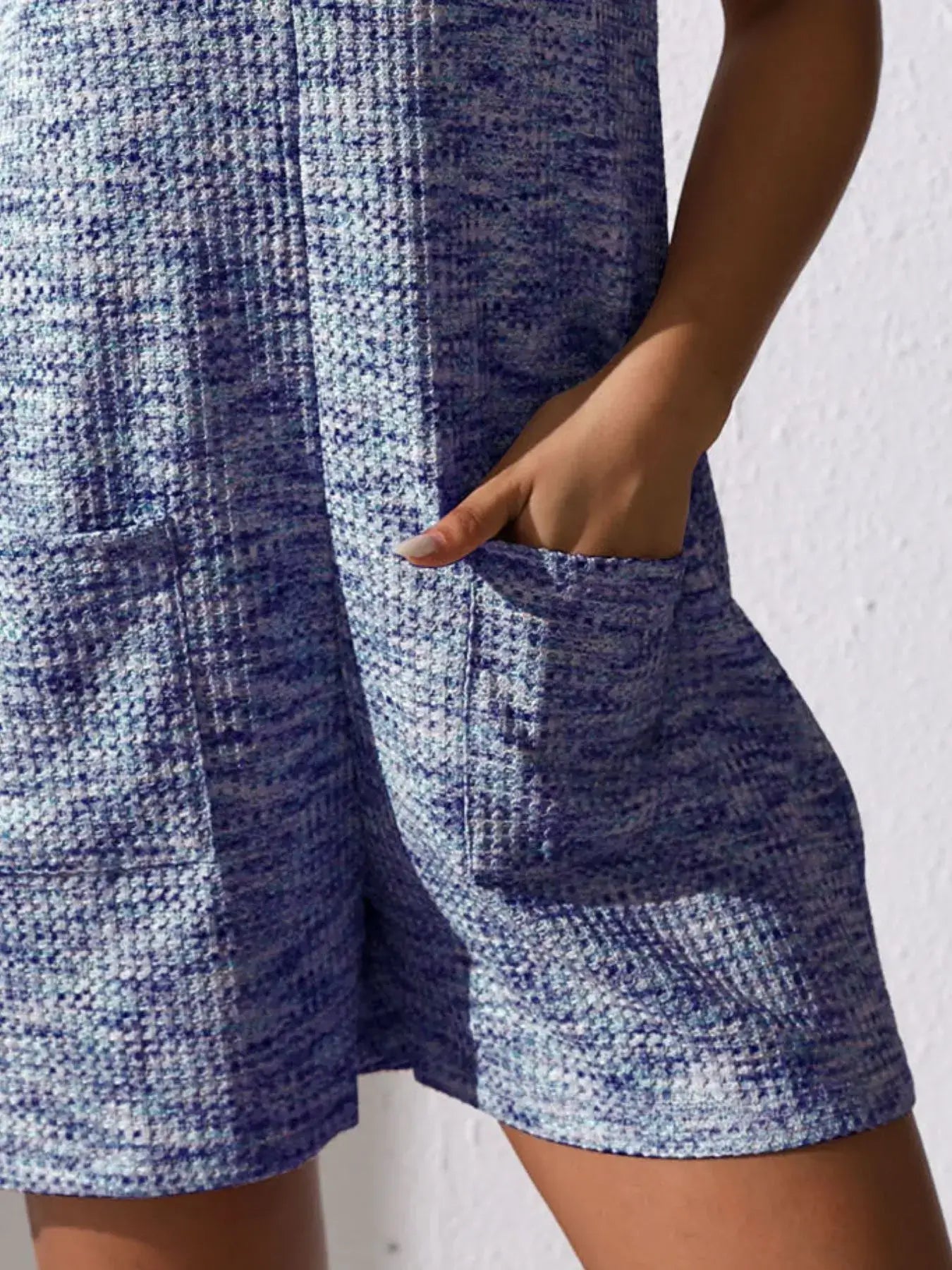 Full Size Button Front Romper with Pockets featuring stylish fabric and functional pockets.