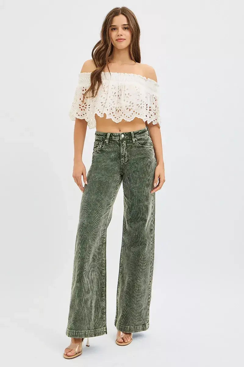 Woman wearing RISEN Full Size High Rise Wide Leg Corduroy Jeans in green with an off-shoulder white top.