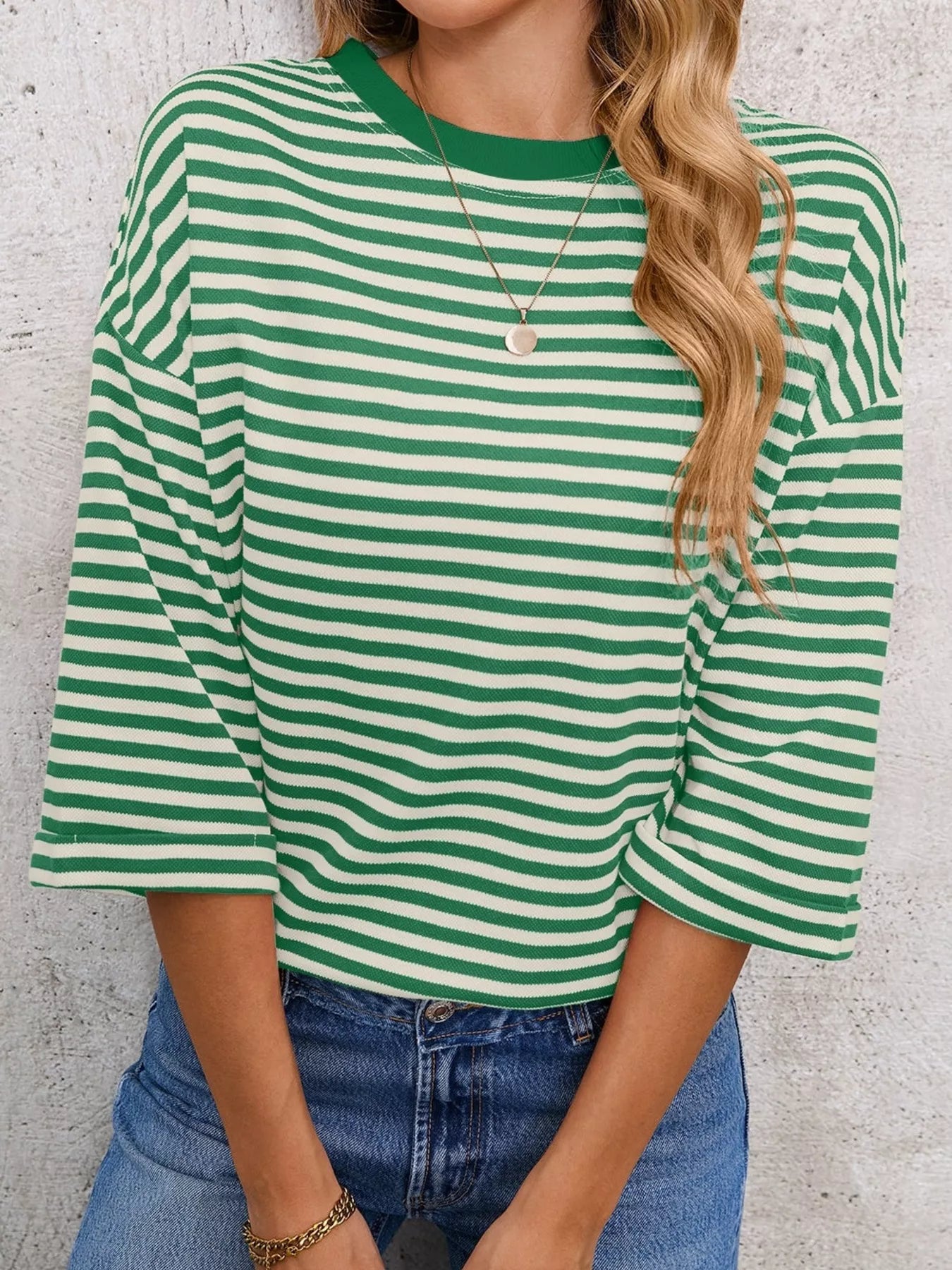 Striped Back Bow Tie T-Shirt in green and white stripes, styled for casual everyday fashion.