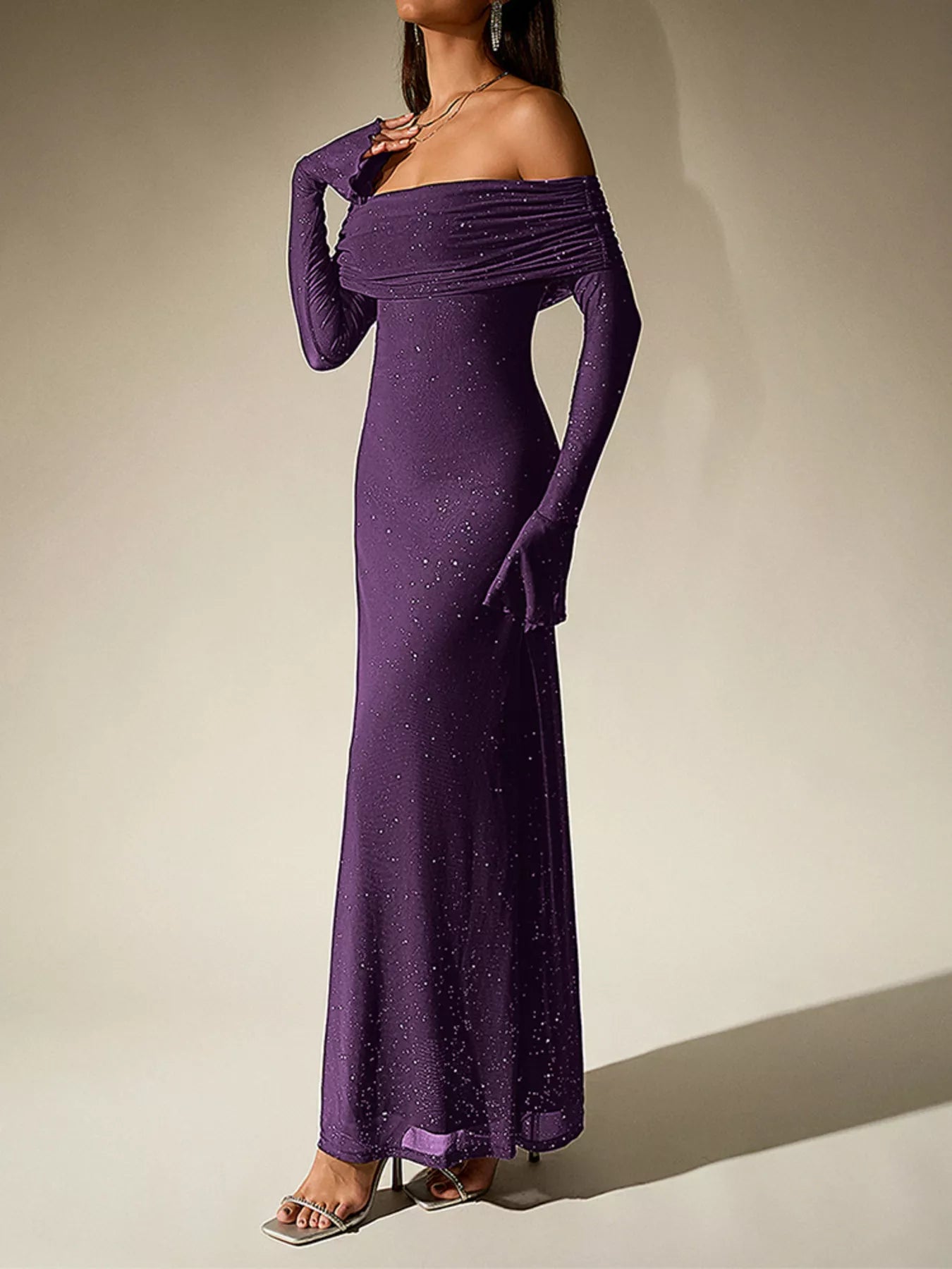 Glitter Off-Shoulder Maxi Dress in purple, featuring long sleeves and shimmering details for elegant evening looks.