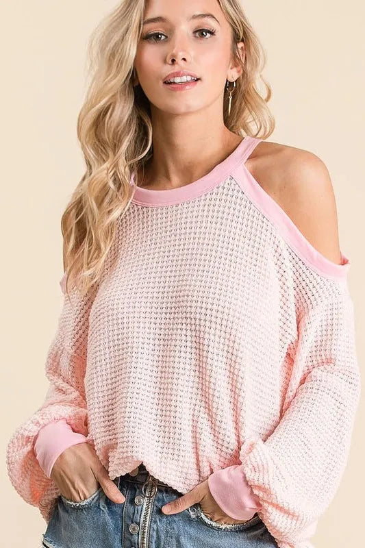 BiBi Popcorn Waffle Top with Cold Shoulder Detail for Women model wearing a cozy pink top with trendy cold shoulder design