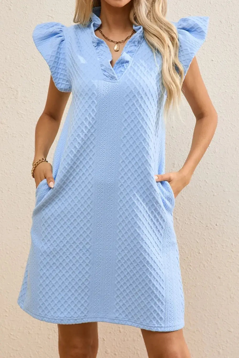 Light blue ruffled V-neck cap sleeve mini dress with pockets, perfect for a chic and casual everyday look.