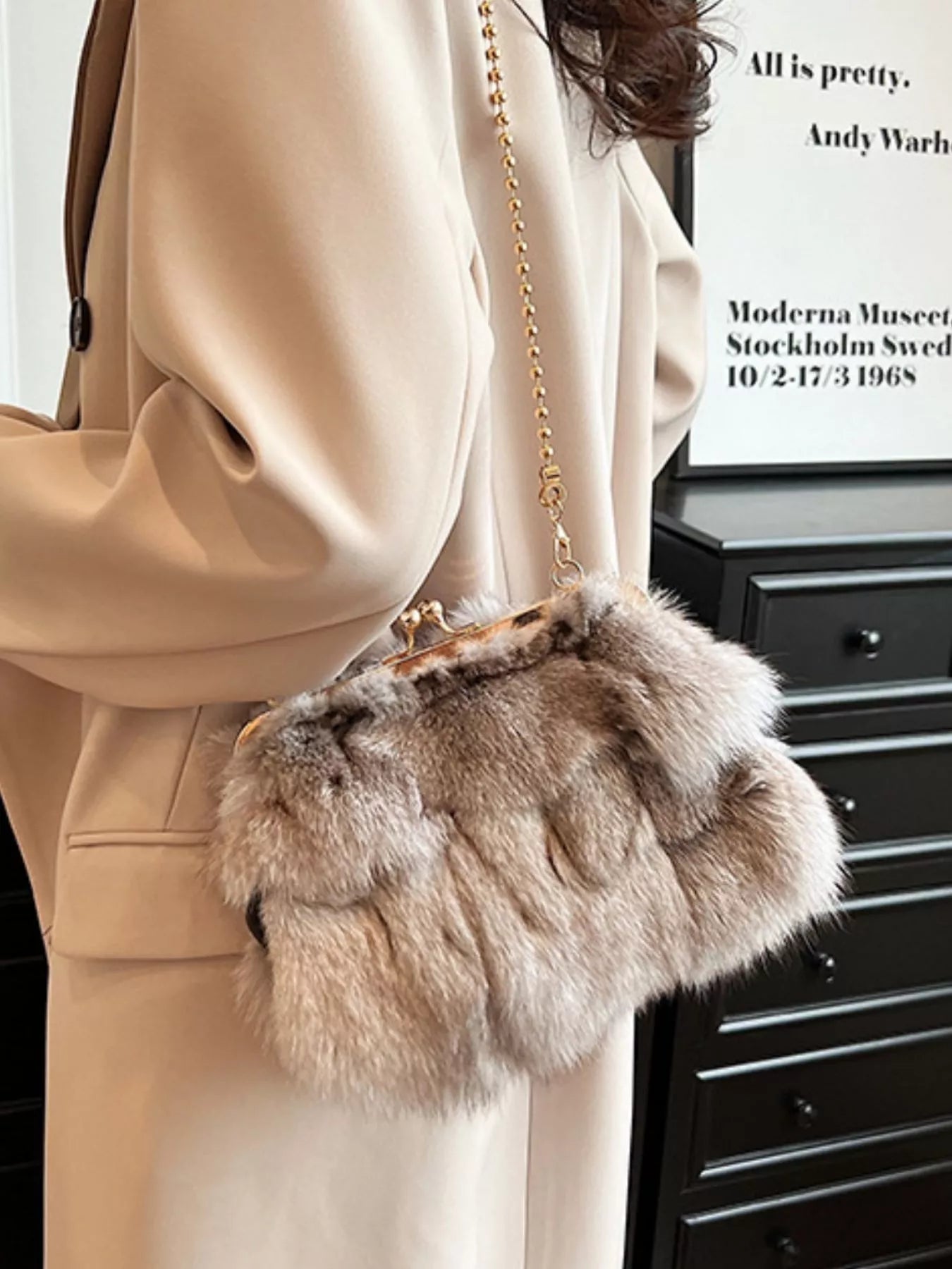 Furry Chain Crossbody Bag displayed in a casual outfit, showcasing its soft fox fur material and stylish design.