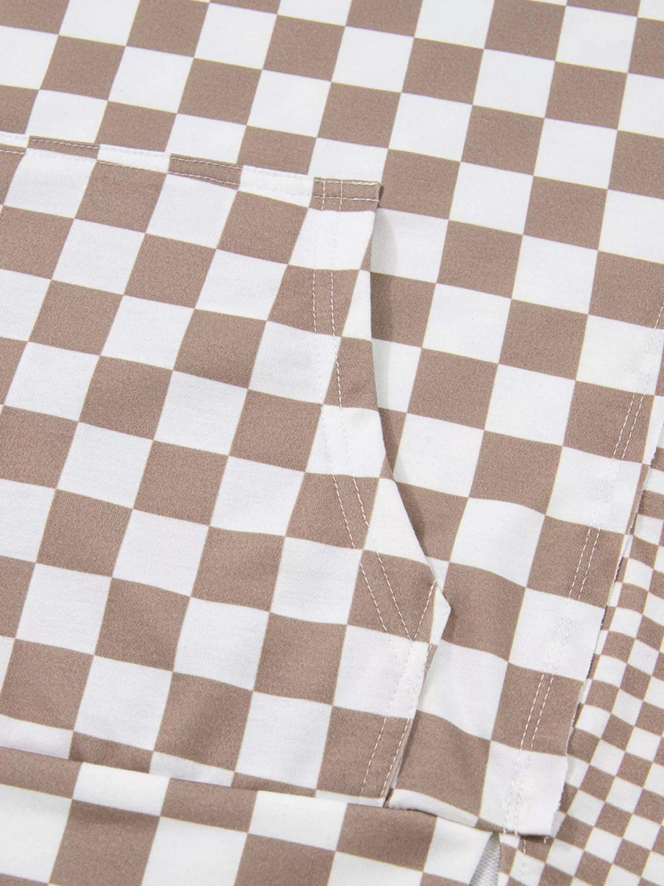 Checkered Pattern Oversized Drawstring Hoodie fabric close-up showing pocket and checkered design in beige and white.