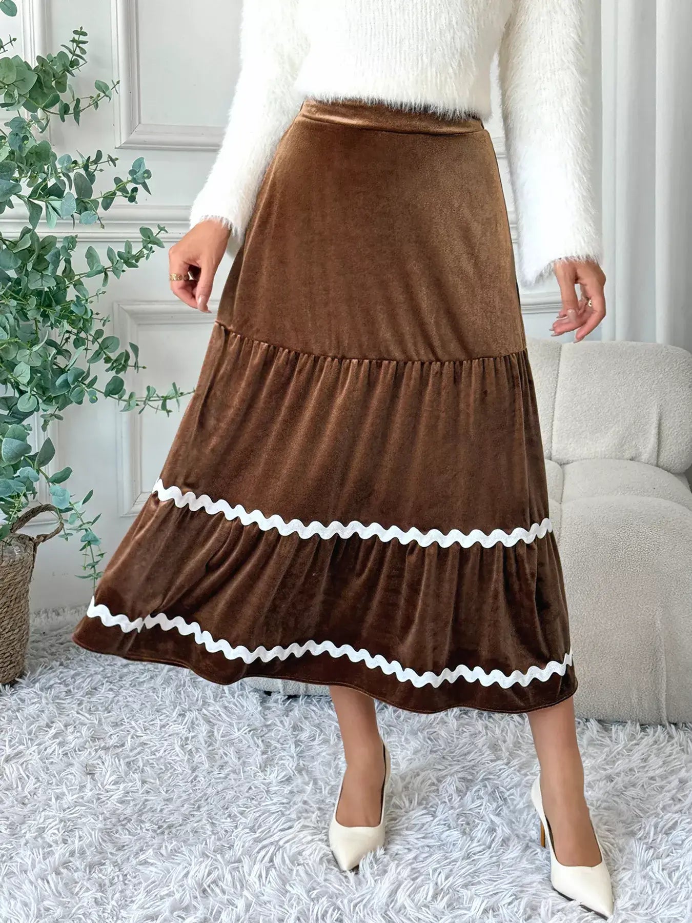 Velvet Tiered Midi Skirt in rich brown with a ruched design and contrasting white trim, ideal for chic and elegant outfits.