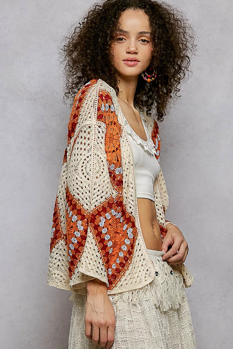 Model wearing POL Open Front Crochet Cardigan, showcasing granny square pattern and bohemian style.