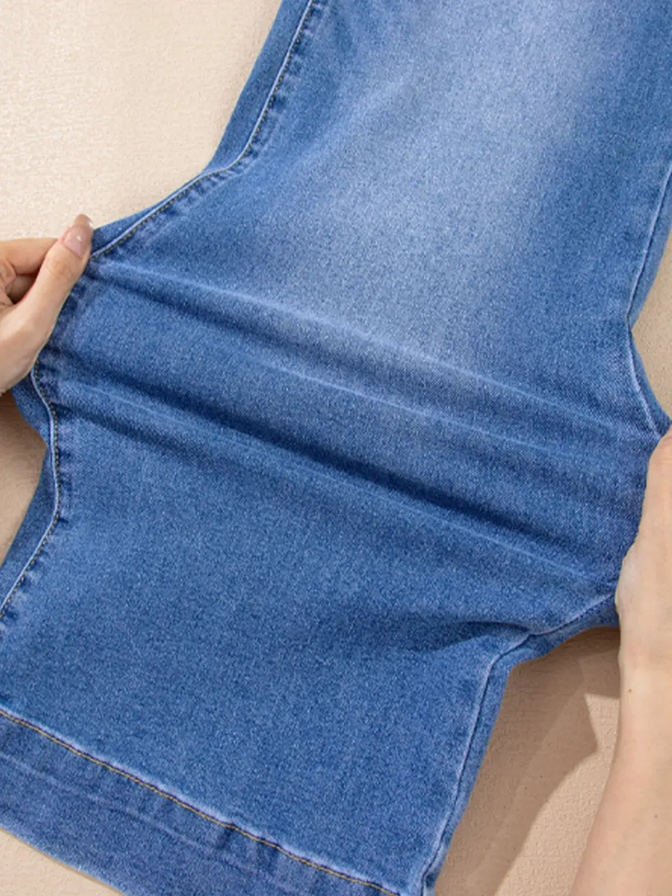 High-Waisted Wide Leg Flare Jeans close-up showing fabric texture and leg openings