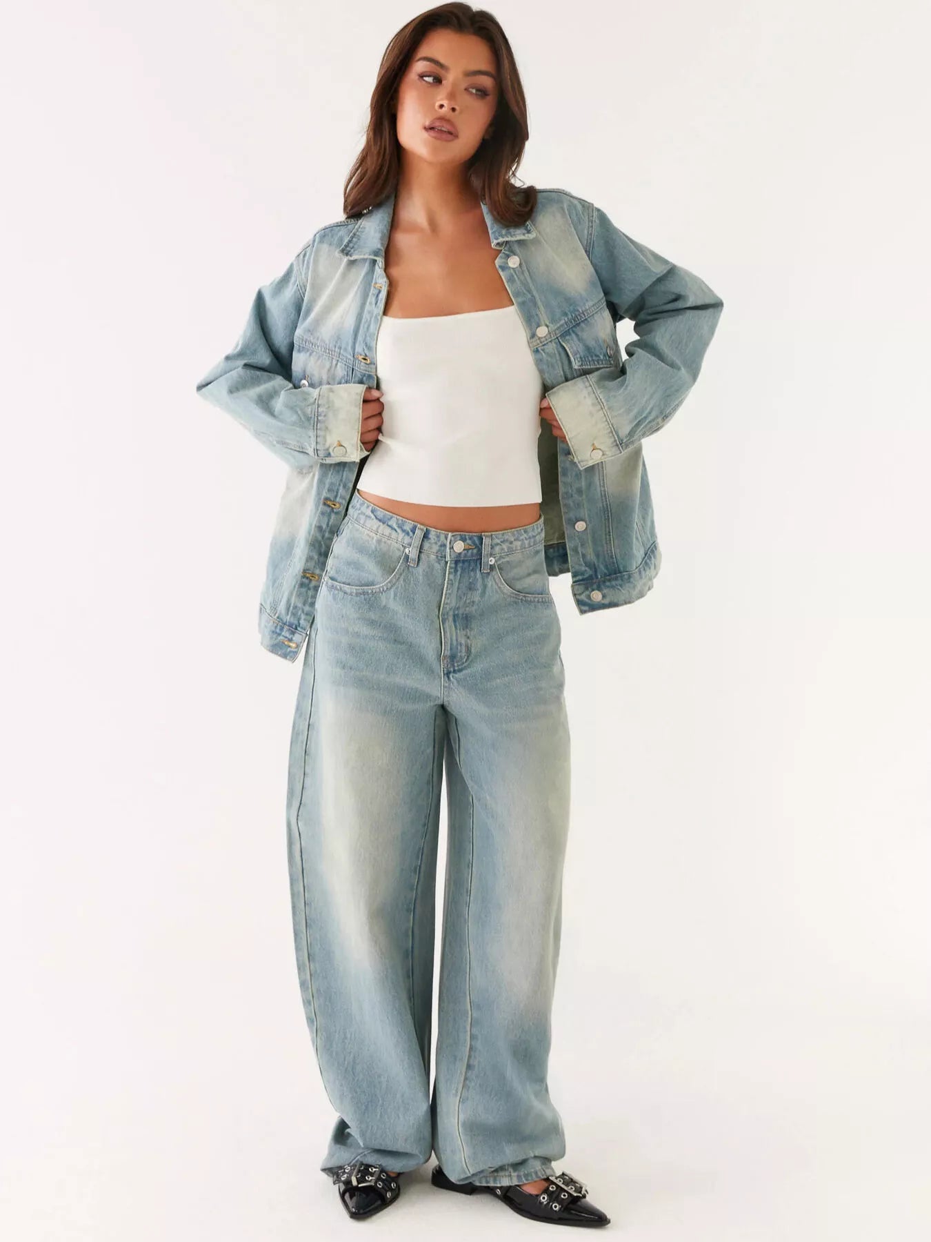 Model wearing a Button Up Denim Jacket and Jeans Set, showcasing a modern style with buttoned, pocketed, and no stretch features.