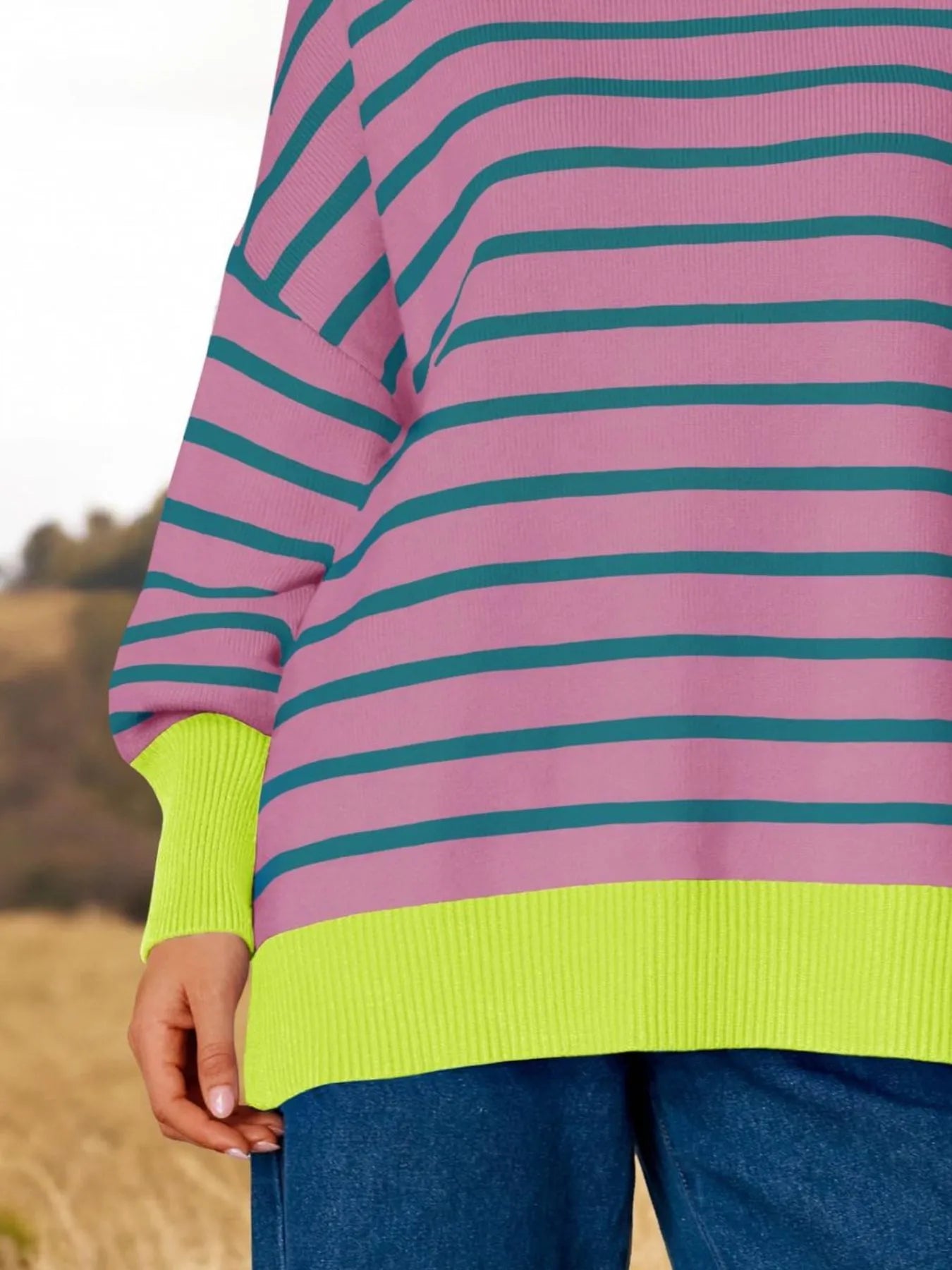 Striped Round Neck Long Sleeve Sweater featuring oversized fit and vibrant pink and green colors.