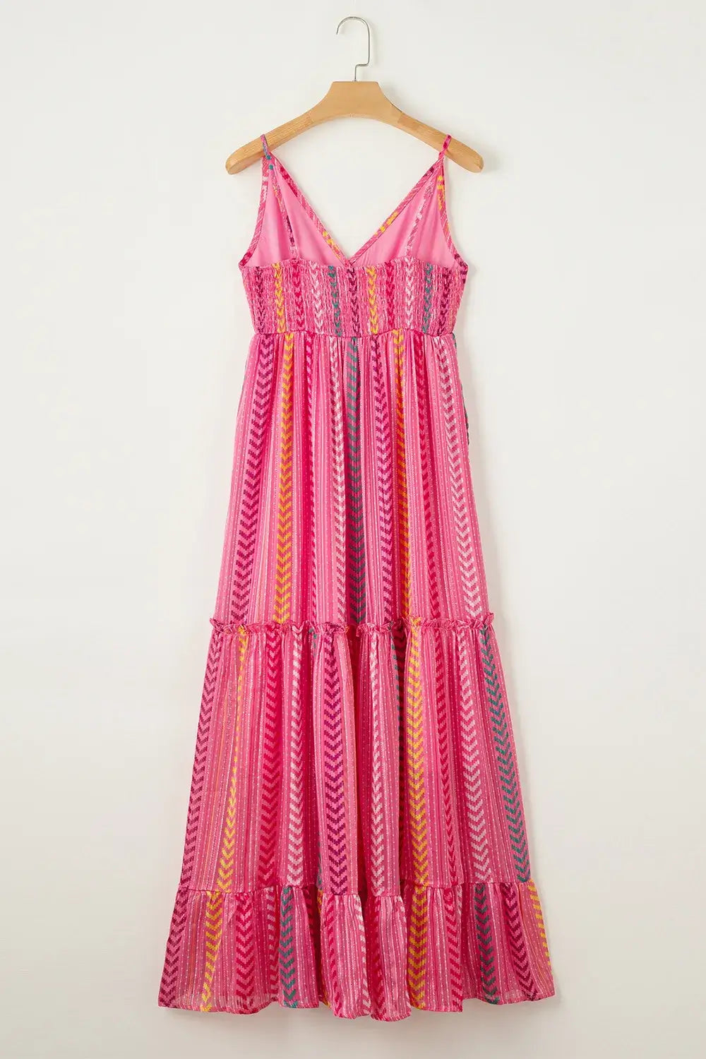 Printed Surplice Maxi Cami Dress displayed on hanger with colorful stripes and flowing maxi design.