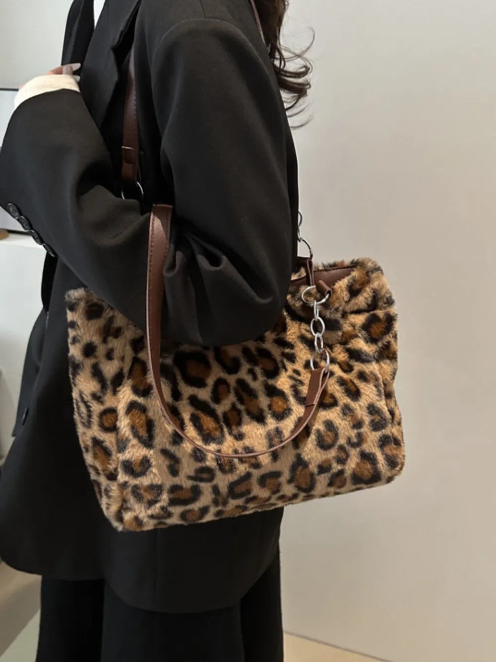 Faux Fur Leopard Shoulder Bag displayed on a model, showcasing bold style and faux fur material.