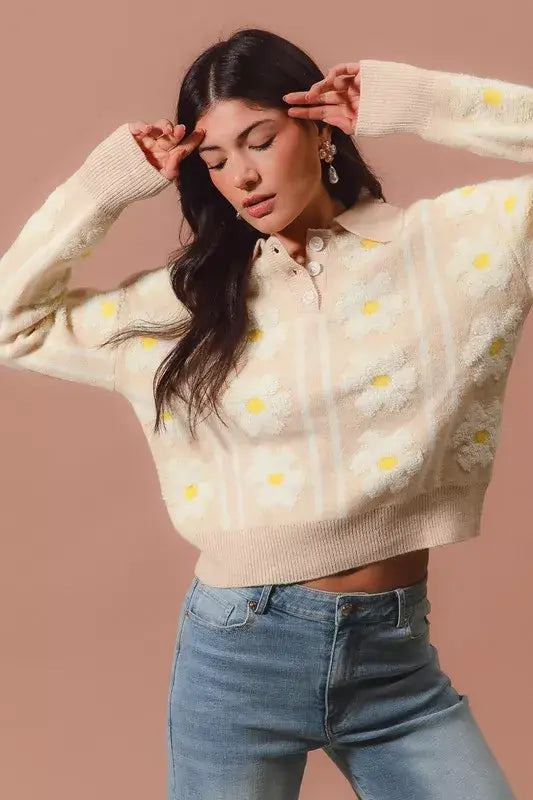 Model wearing SO ME floral stripe polo collar sweater with daisy patterns and stripes, stylish and chic knit design.