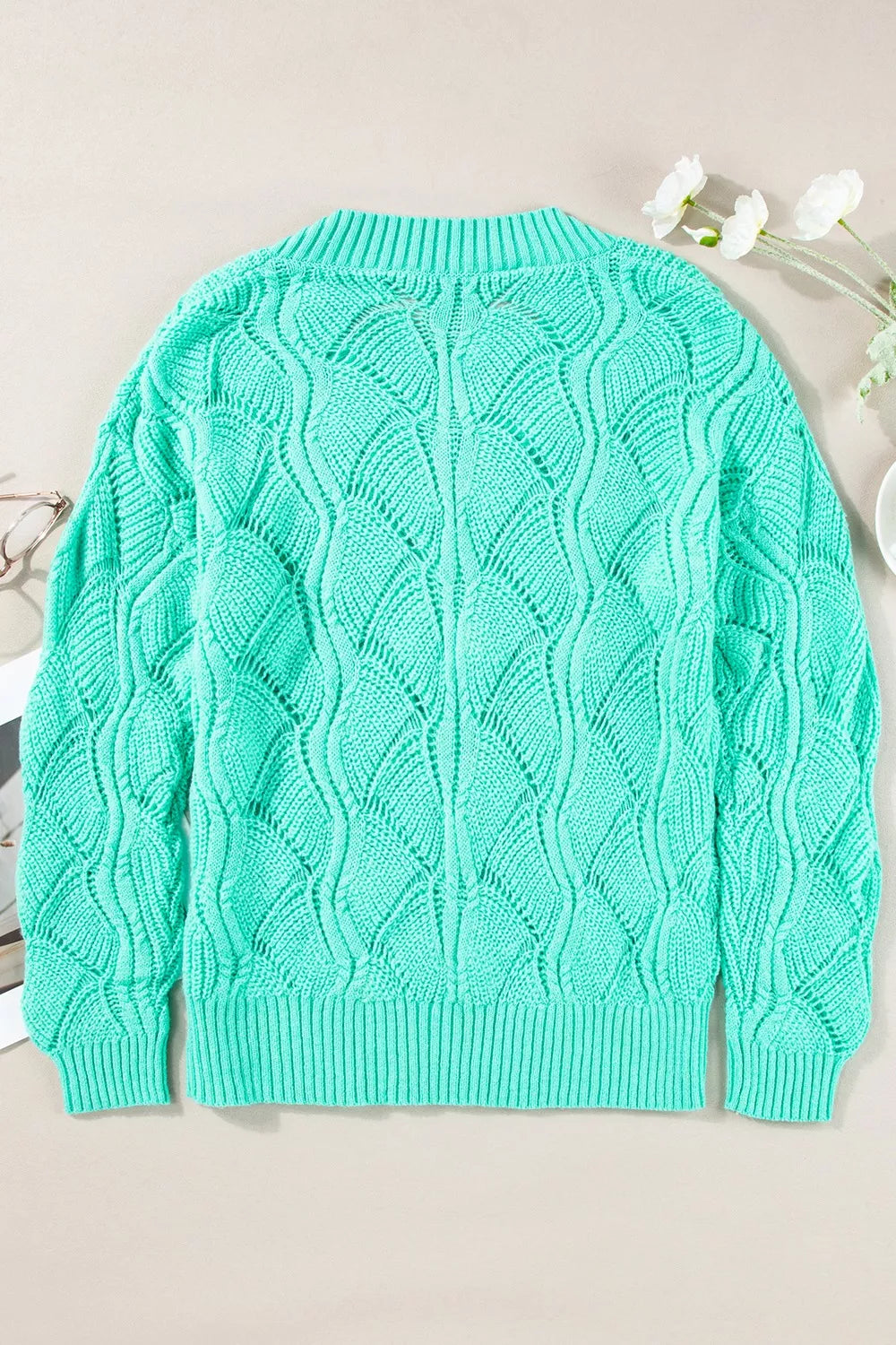 Elegant Texture V-Neck Knit Top – Women’s Cable Knit Sweater in vibrant mint green with intricate cable-knit design.