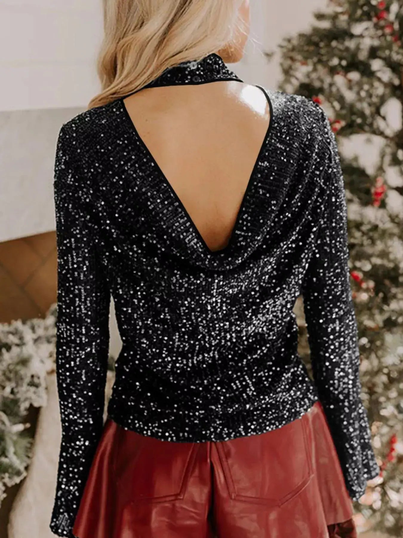 Sequin Mock Neck Drape Open Back Bell Sleeve Top showcased from the back, featuring shimmering sequins and elegant bell sleeves.
