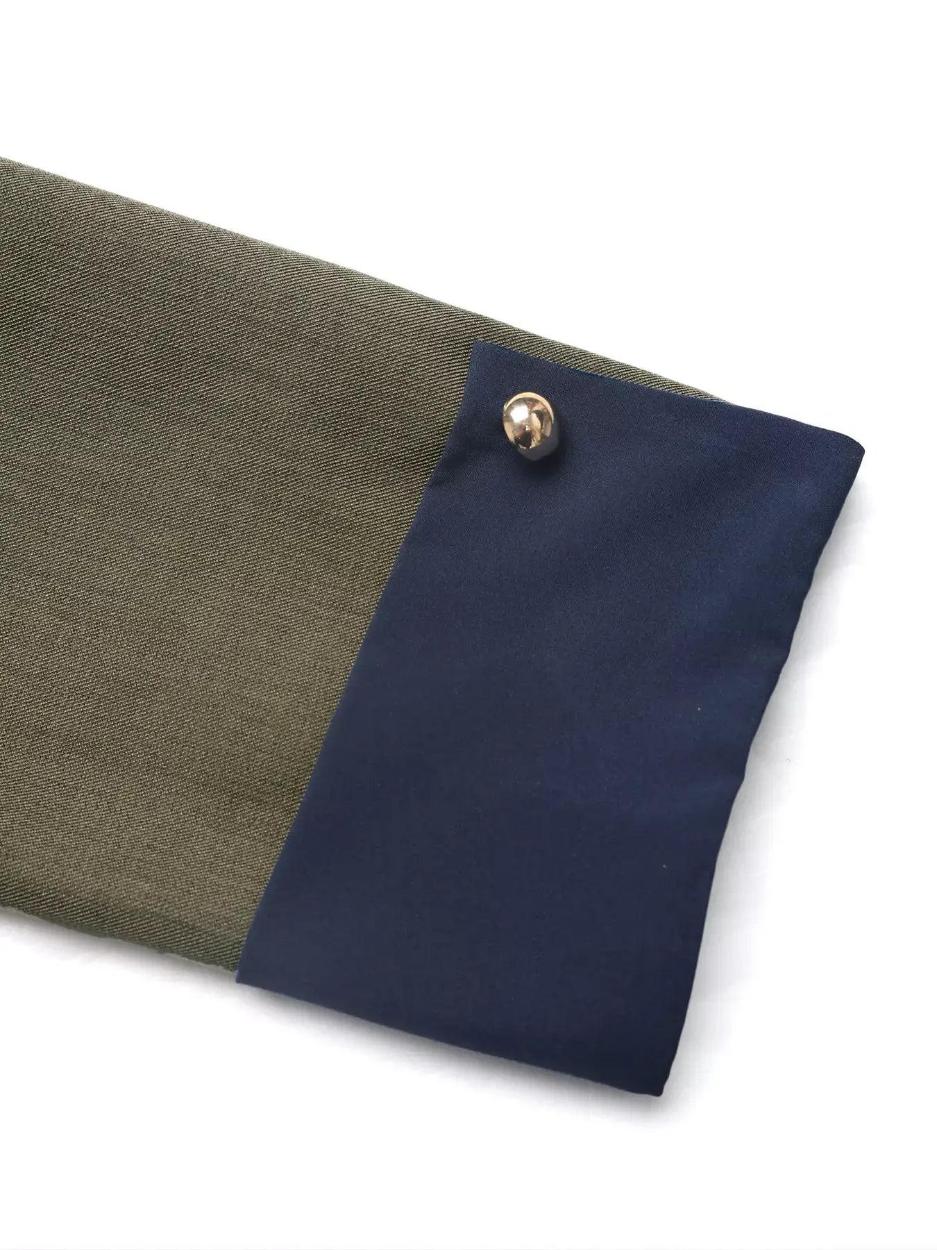 Detail of the Contrast Trim Button-Up Jacket showing the sleeve with a stylish contrast trim.