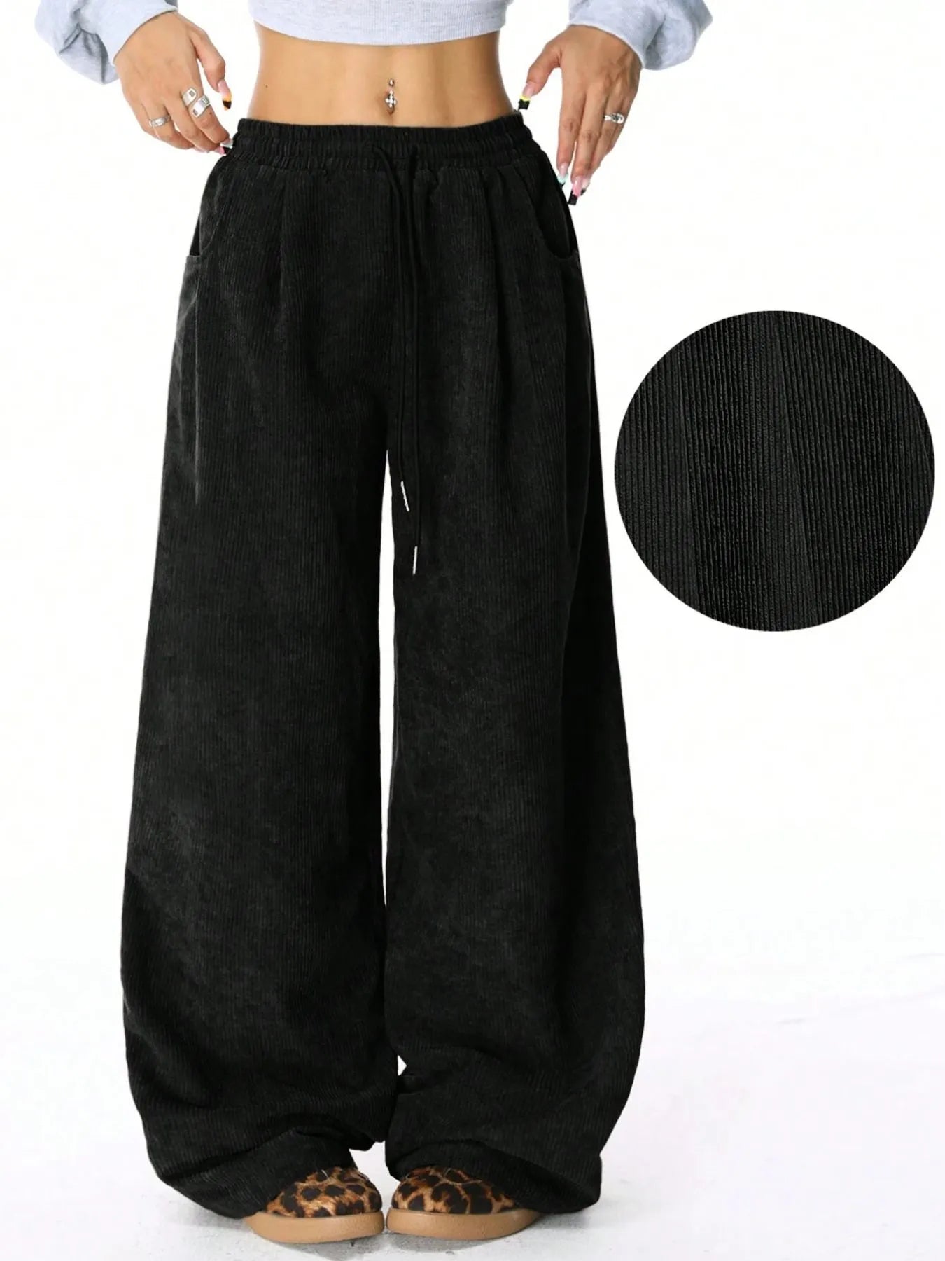 Drawstring Wide Leg Pants for Relaxed Everyday Comfort in black with a drawstring feature and pocketed design.