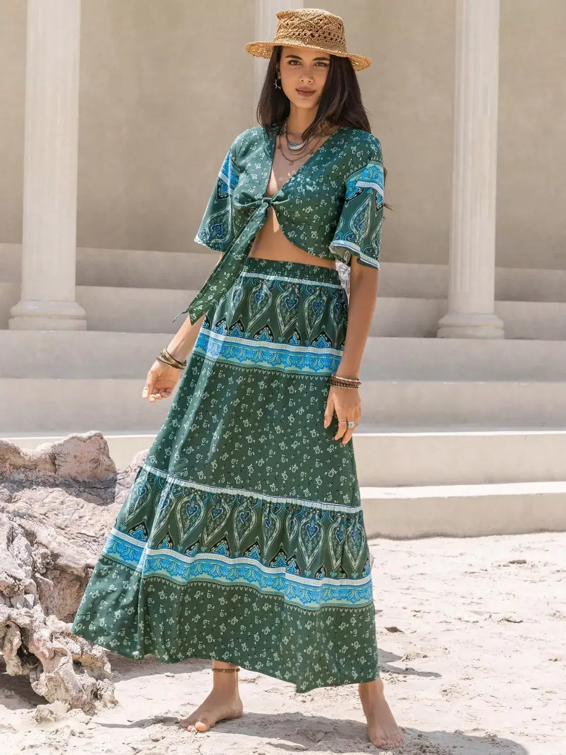 Women wearing a Tie Front Half Sleeve Top and Skirt Set, showcasing a trendy green outfit in a summer setting.