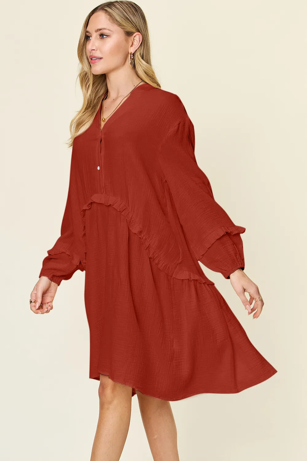Double Take Full Size Texture Half Button Ruffle Trim Dress in rust color on model with flowing sleeves