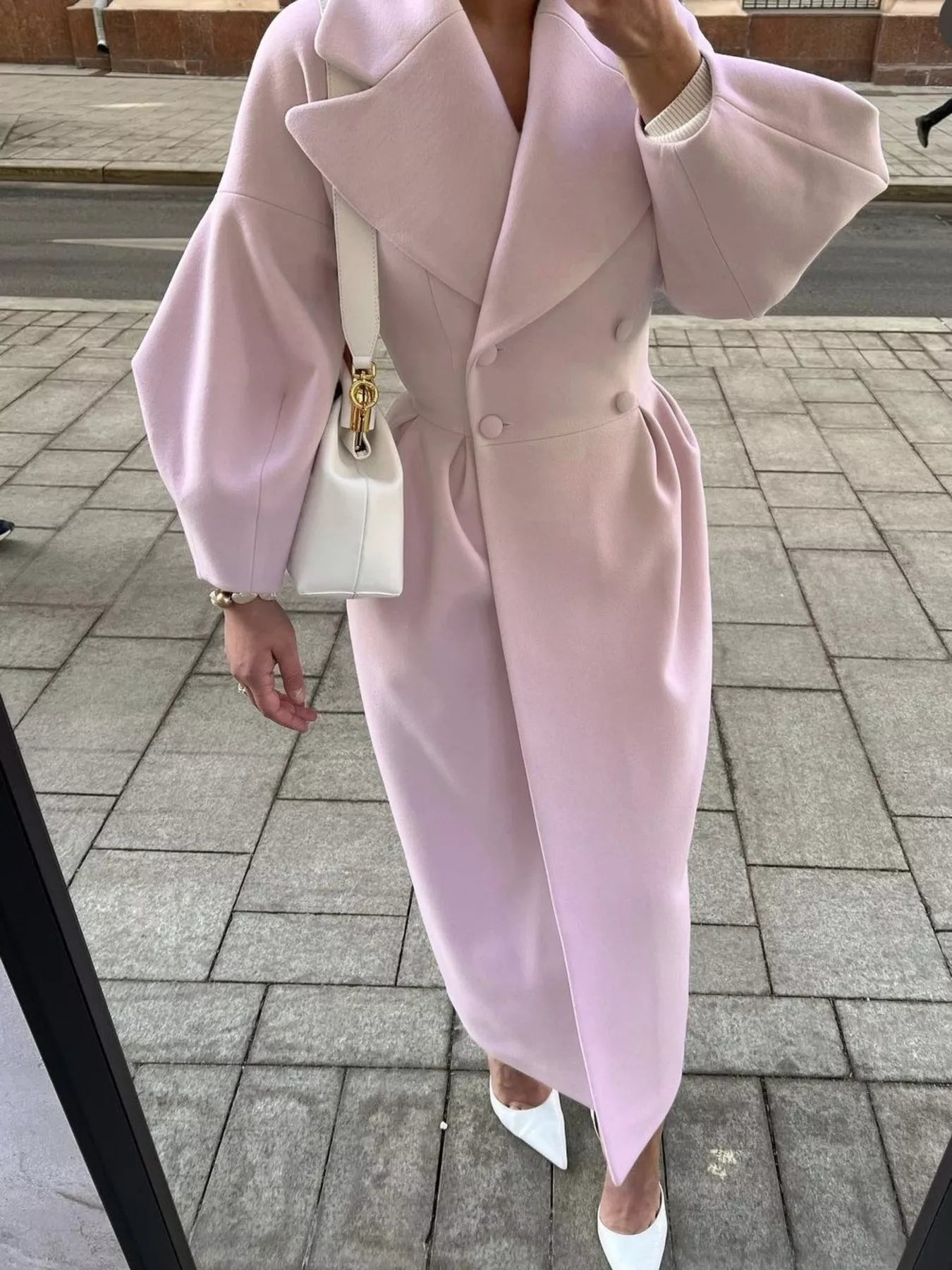 Double-Breasted Longline Coat in soft pink with elegant tailored silhouette and oversized sleeves.