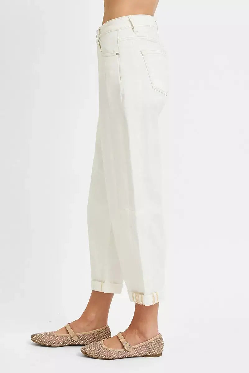 Side view of RISEN Full Size High Rise Barrel Cropped Jeans Plus Size in white, featuring a stylish, modern silhouette.