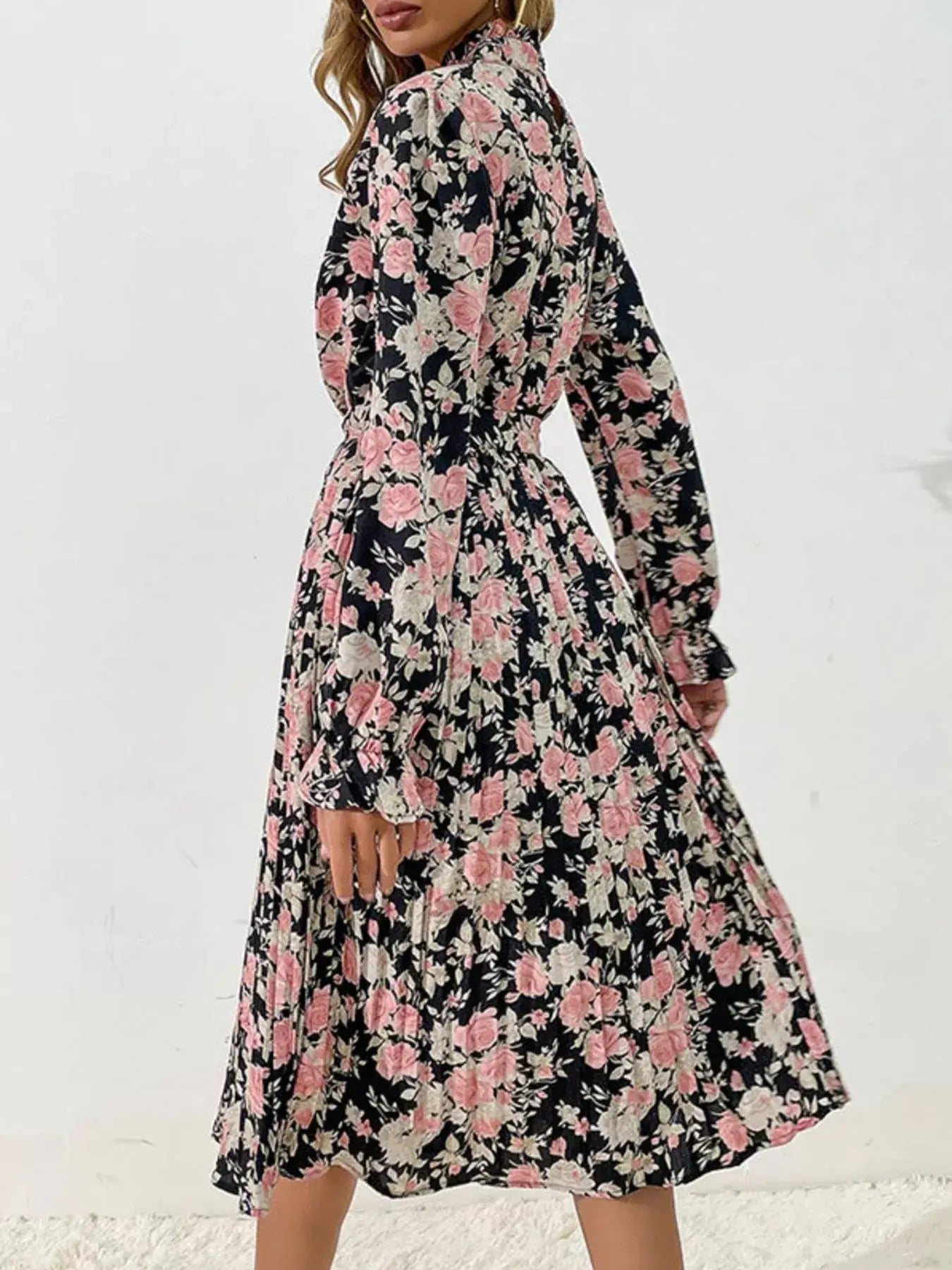 Floral Print Long Sleeve Pleated Midi Dress showcasing a floral pattern and elegant pleated design in a stylish setting.