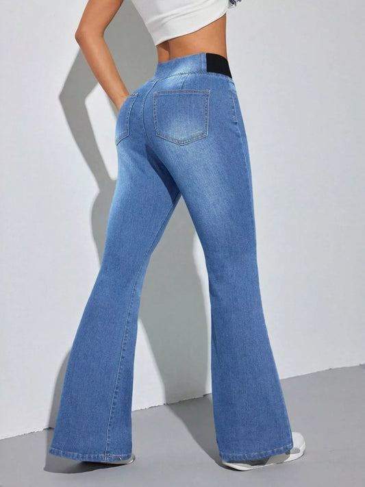 Model wearing High Waist Flare Leg Jeans from the back, showcasing the flattering fit and flare design.