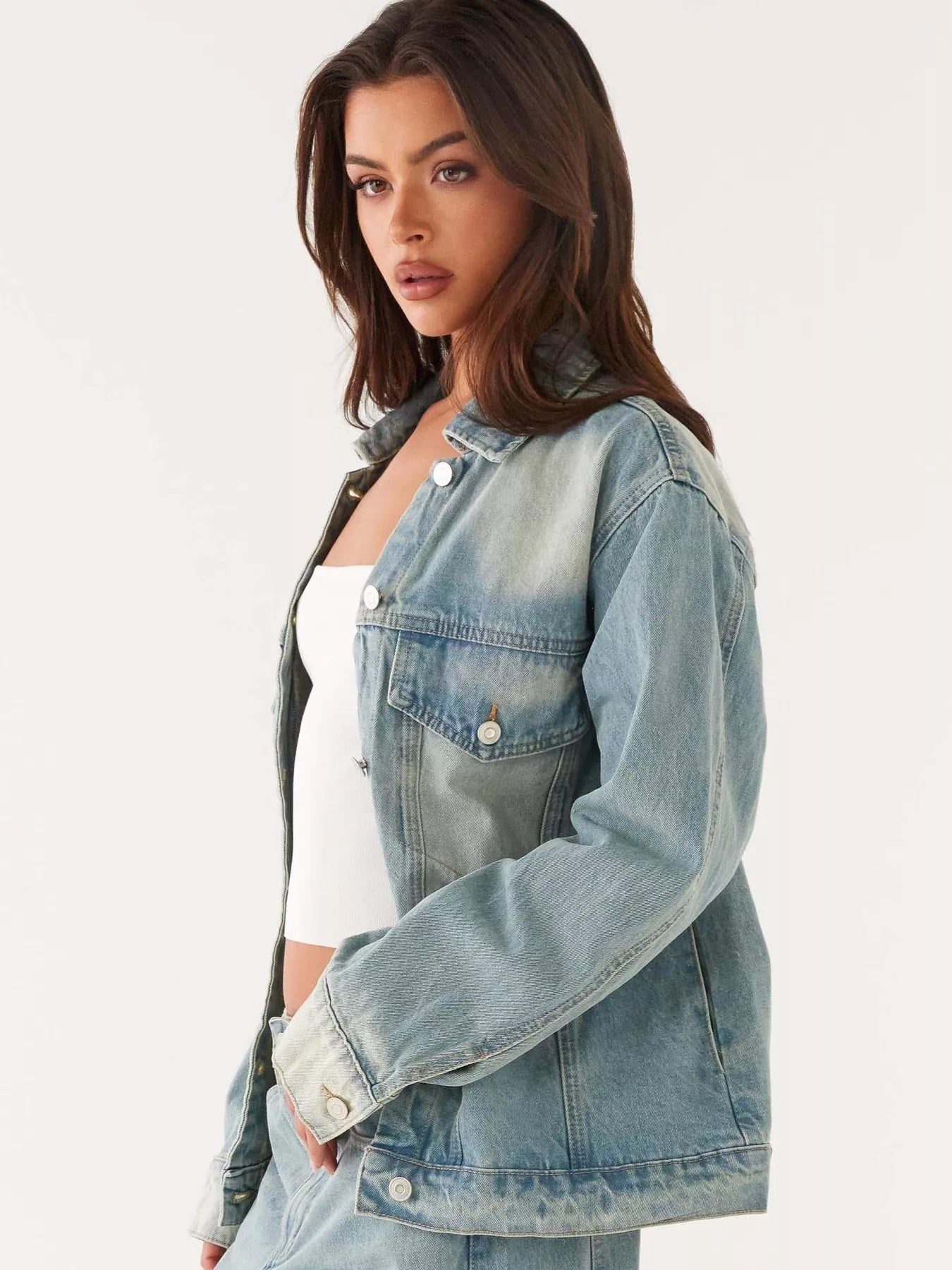 Button Up Denim Jacket and Jeans Set displayed on a model, featuring a light blue denim jacket with button details.