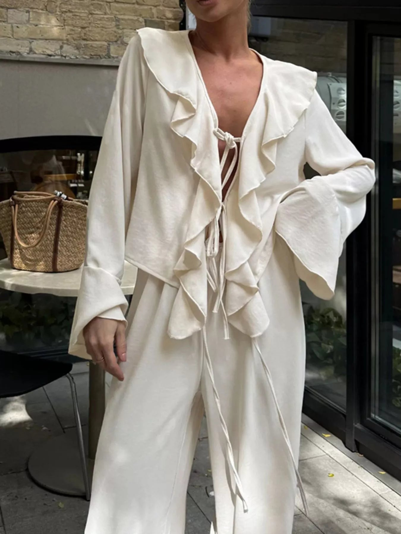 Ruffle Trim Tie Front Top and Pants Set for Women, featuring a stylish ruffled design and tied front in a chic cream color.