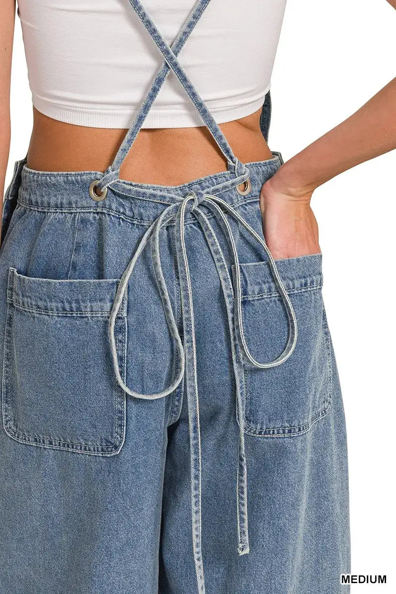 Back view of Zenana Denim Wide Leg Overalls showcasing adjustable straps and functional pockets in medium wash.