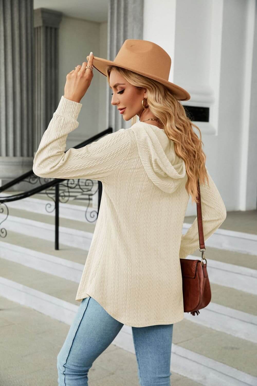 Woman wearing Long Sleeve Hooded Blouse with a hat, showcasing the casual style and cozy design.