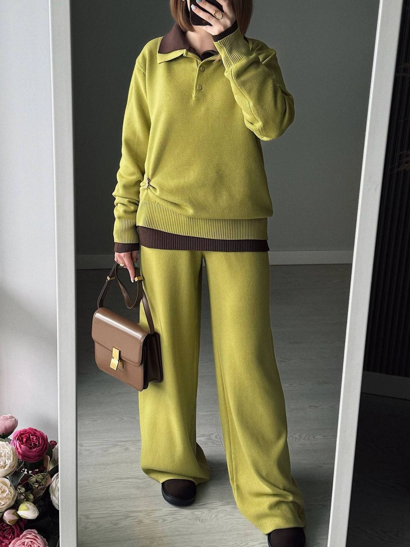 Model wearing a Polo Collar Knit Two Piece Set in lime green, featuring a buttoned top and matching pants, holding a handbag.
