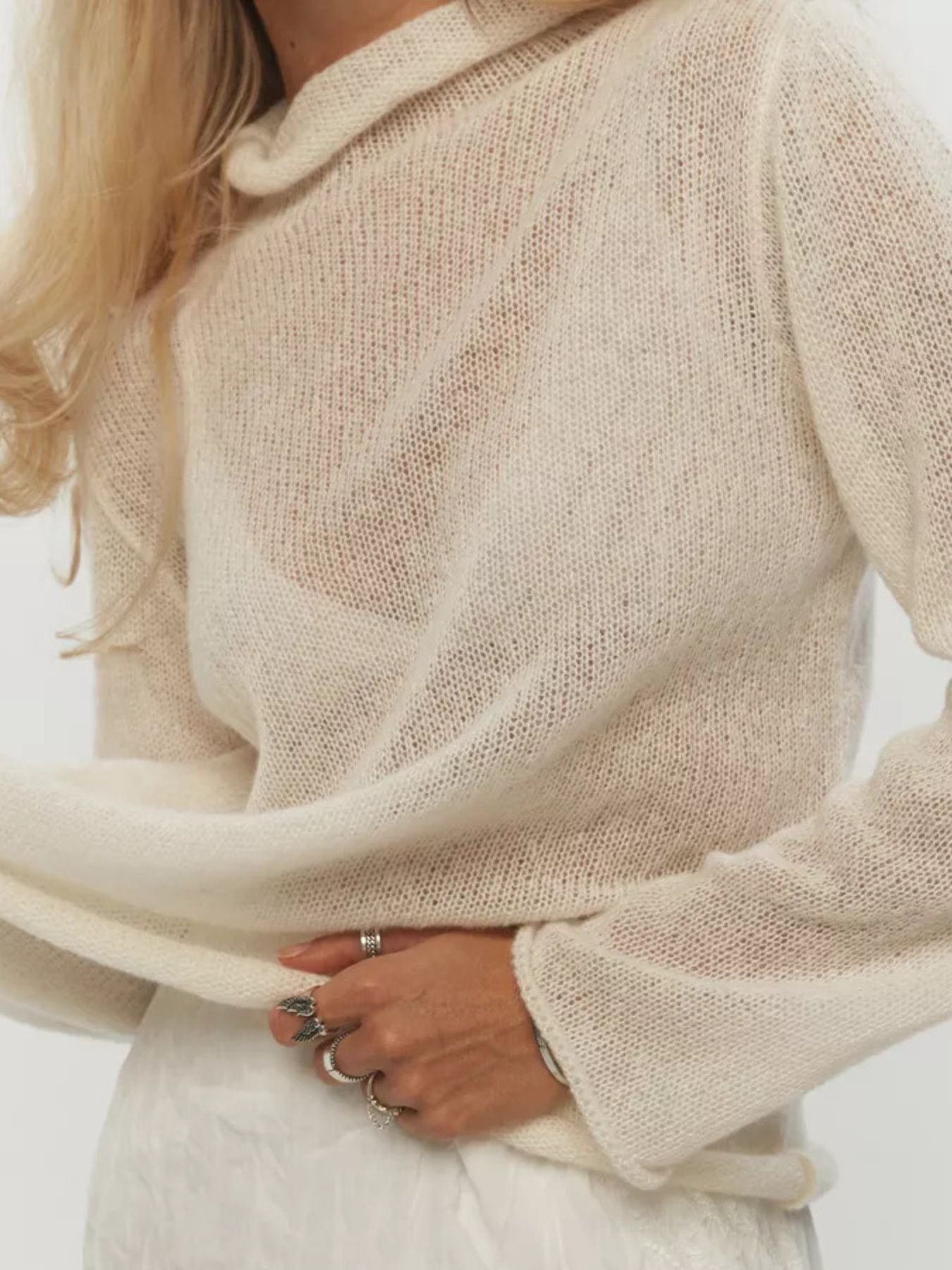 Mock Neck Long Sleeve Sweater in cream, showcasing a relaxed fit and lightweight fabric, perfect for casual styles.