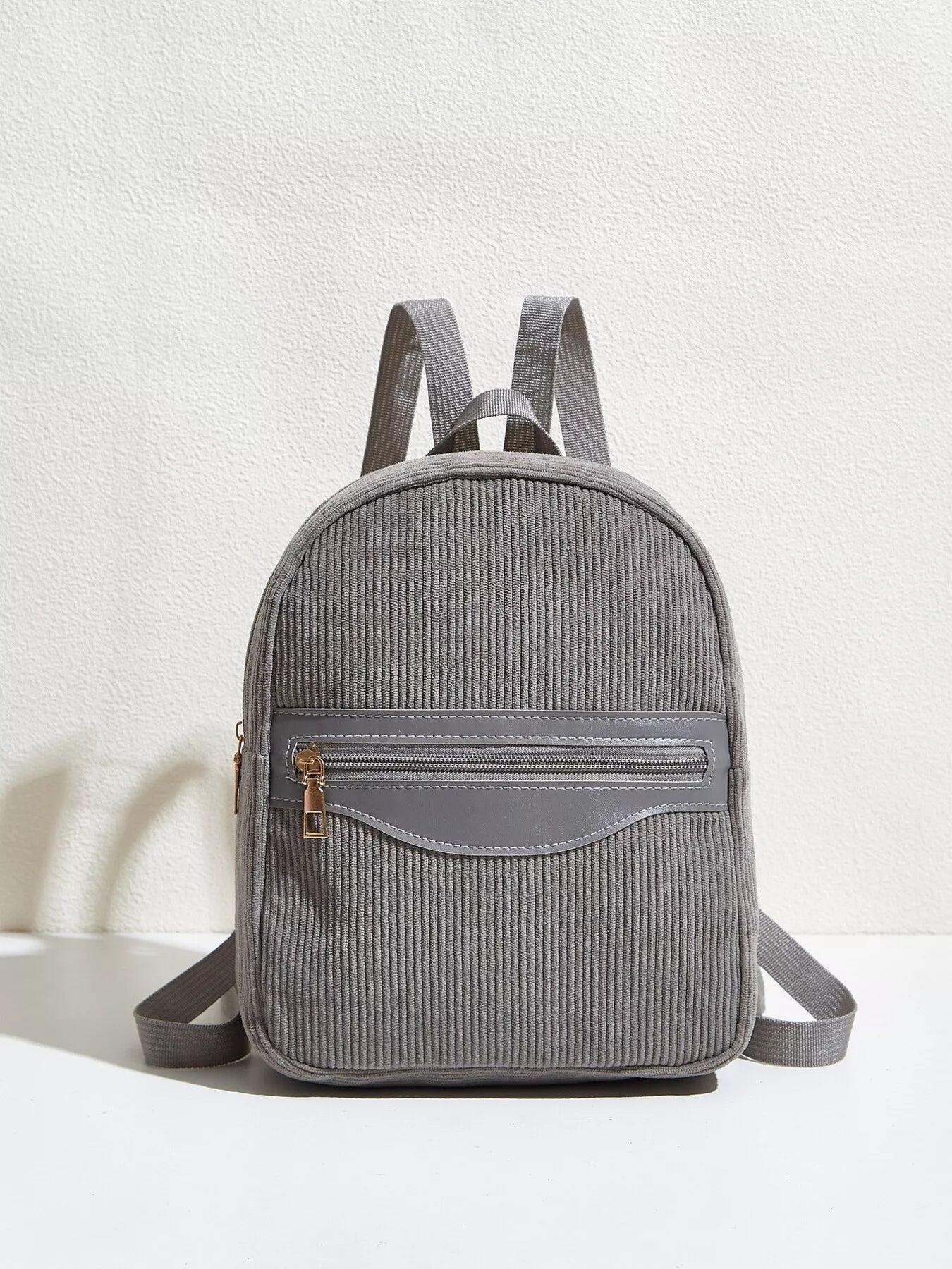 Casual Corduroy Backpack Bag for daily urban use, featuring a gray corduroy design and a front zipper pocket.