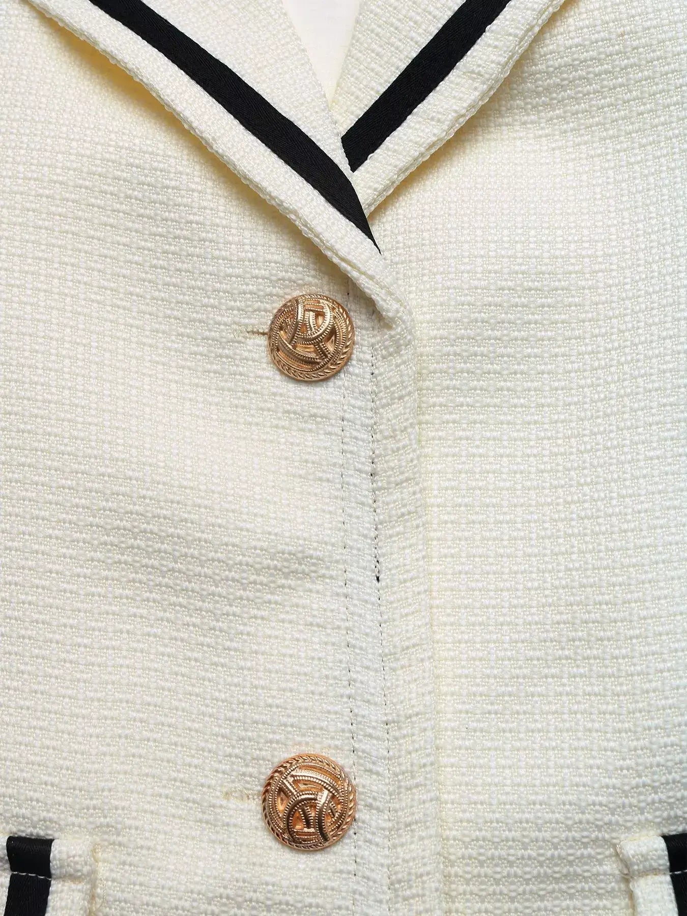 Contrast Trim Button-Up Blazer close-up showing elegant buttons and chic contrast trim details.