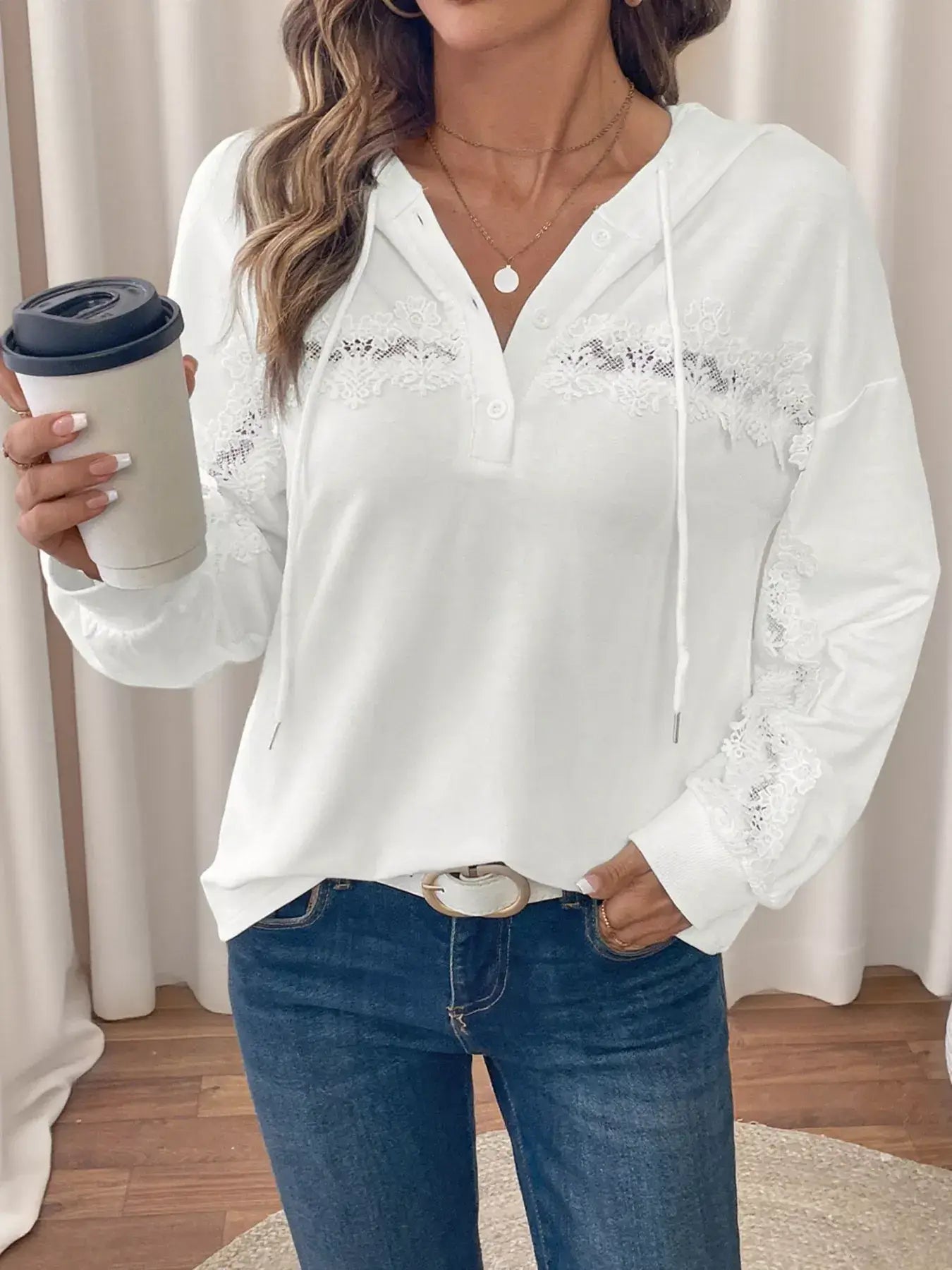 Lace Detail Long Sleeve Drawstring Hoodie in white, featuring lace accents and a drawstring, worn with jeans.