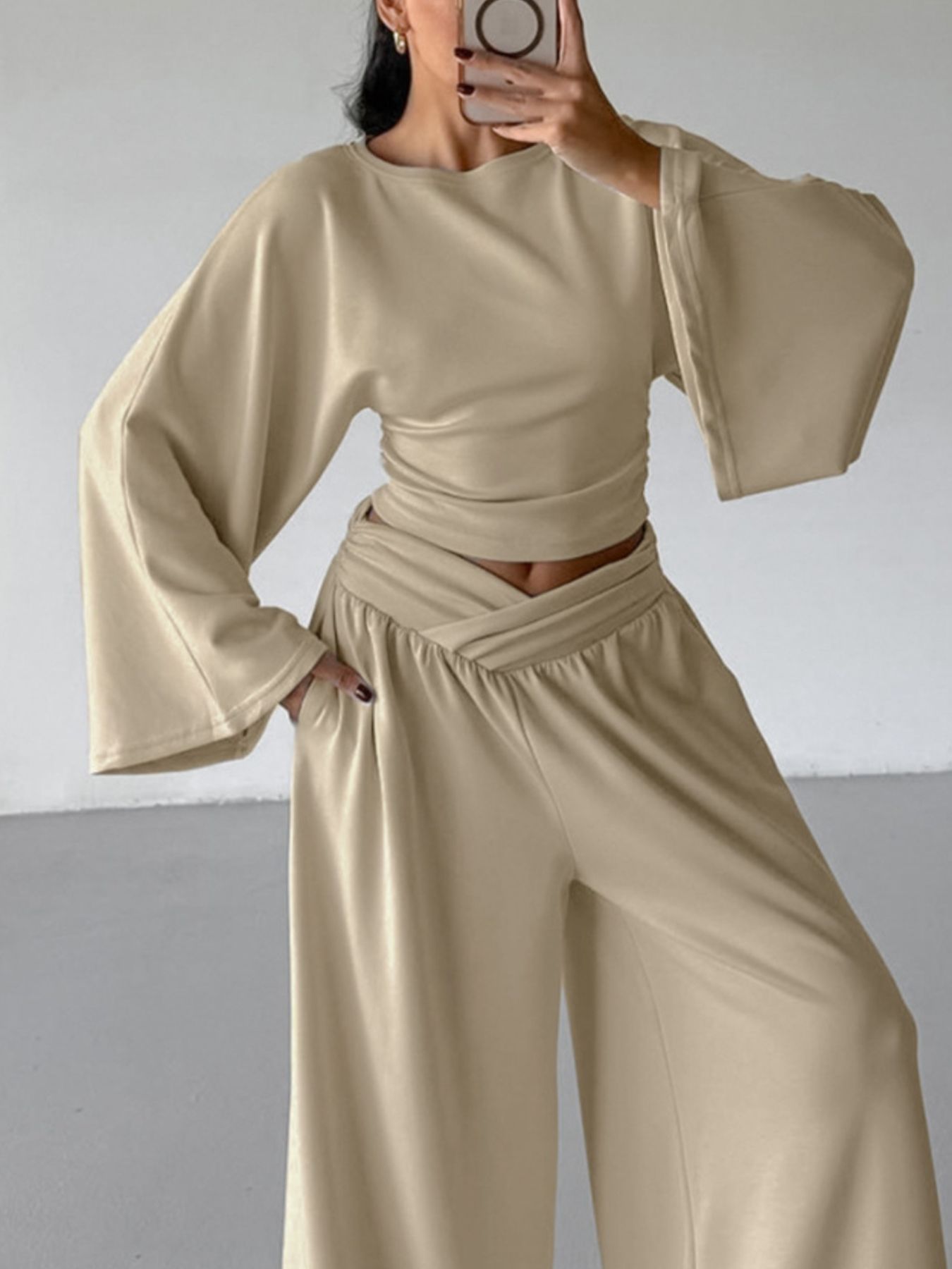 Round Neck Top and Wide Leg Pants Set in beige, featuring a stylish two-piece outfit with bell sleeves and wide leg pants.