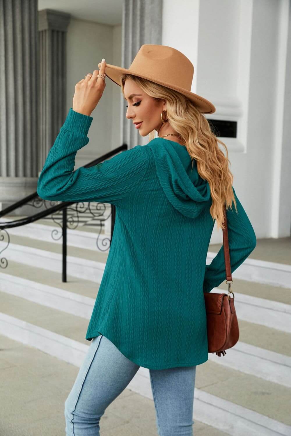 Woman in teal Long Sleeve Hooded Blouse with hat, showcasing casual and cozy style.