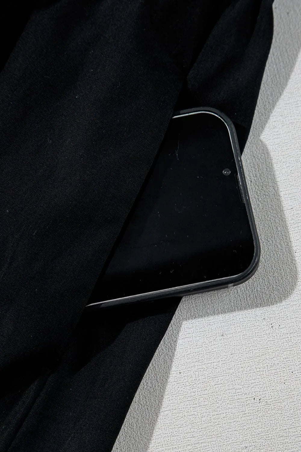 V Neck Ruffled Cap Sleeve Smocked Maxi Dress with phone pocket detail in black fabric.