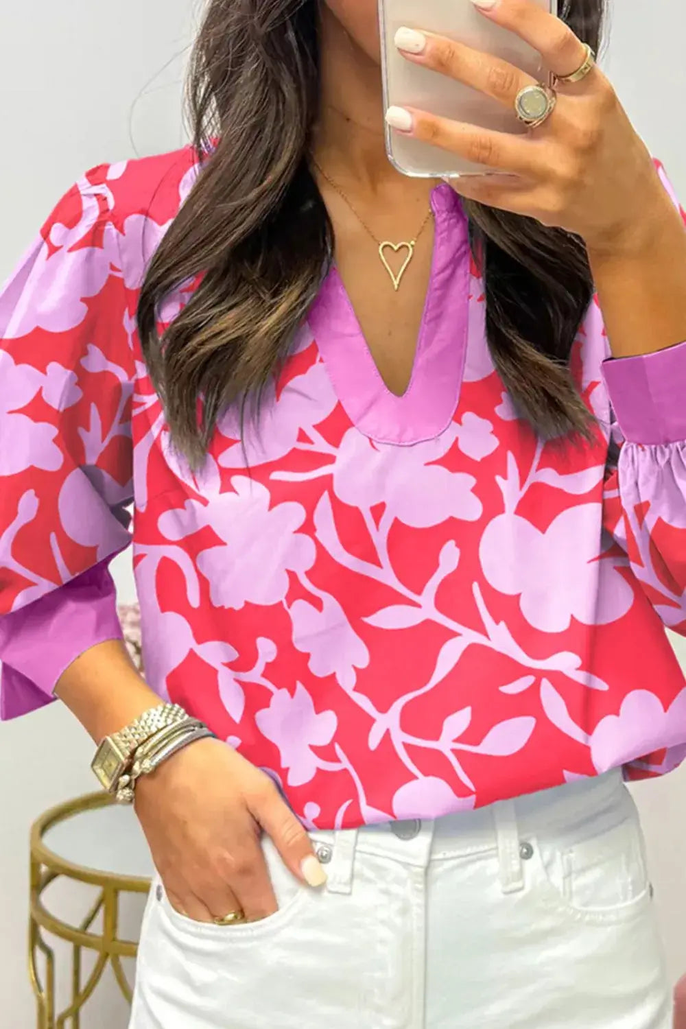 Printed Notched Long Sleeve Blouse in bright floral print featuring a notched neckline and stylish sleeves.