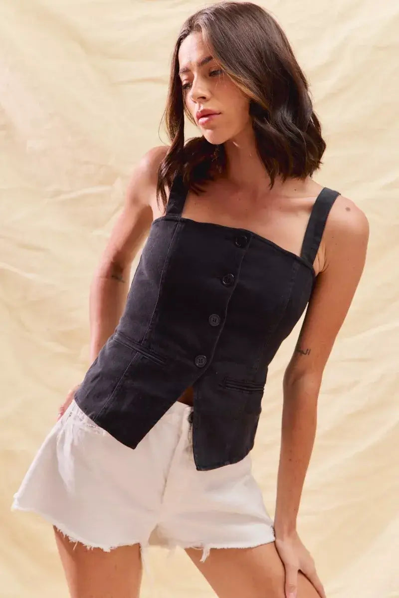 Stylish woman wearing SO ME Button Down Sleeveless Denim Top with white shorts on a light background.