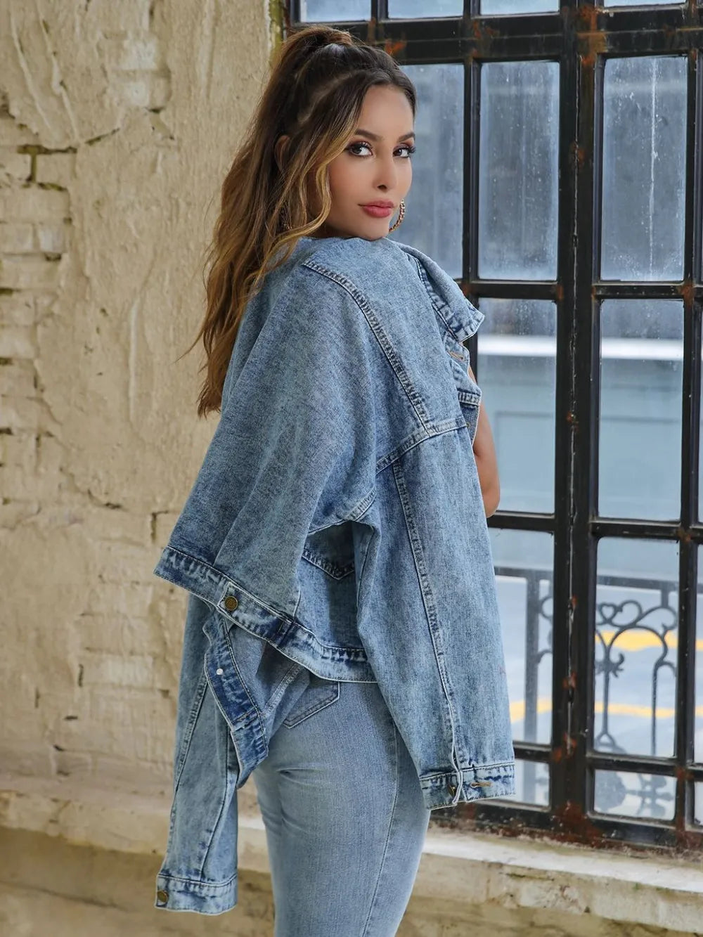 Model showcasing a Button Down Drop Shoulder Denim Jacket for casual layering style.