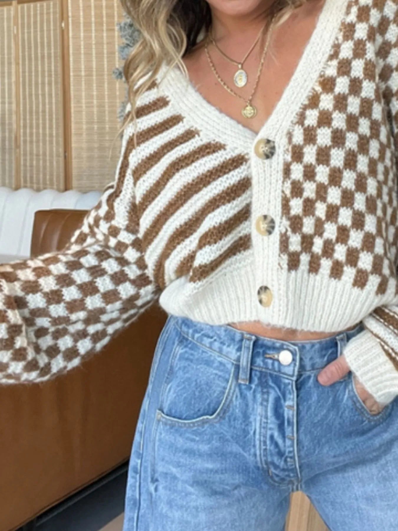 Checkered and Striped Pattern Button-Front Cropped Cardigan style with brown and cream colors, paired with high-waisted jeans.
