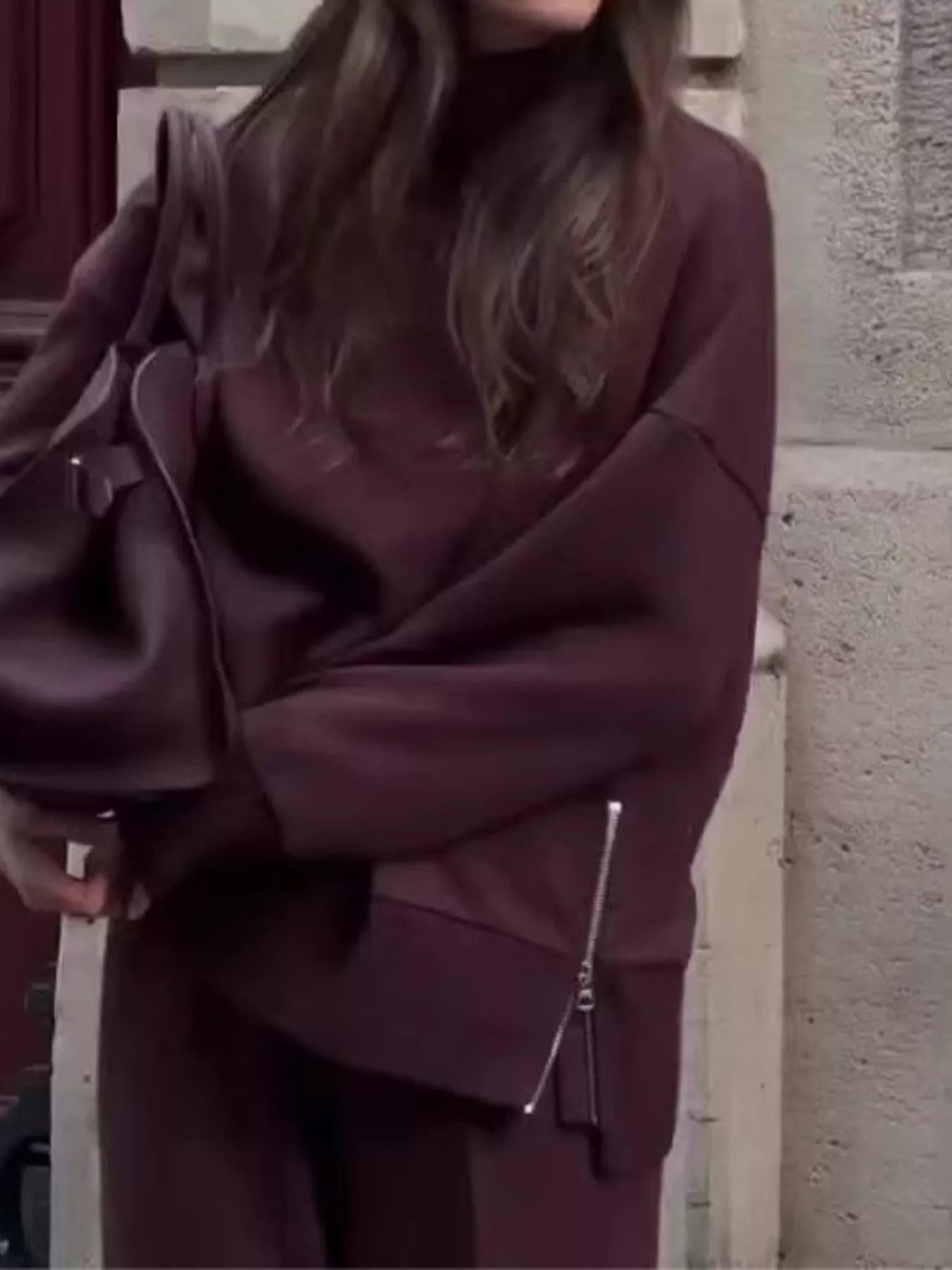 Model wearing a Turtleneck Side Zipper Sweatshirt Pants Set in burgundy, showcasing a casual outfit with a stylish zipper detail.