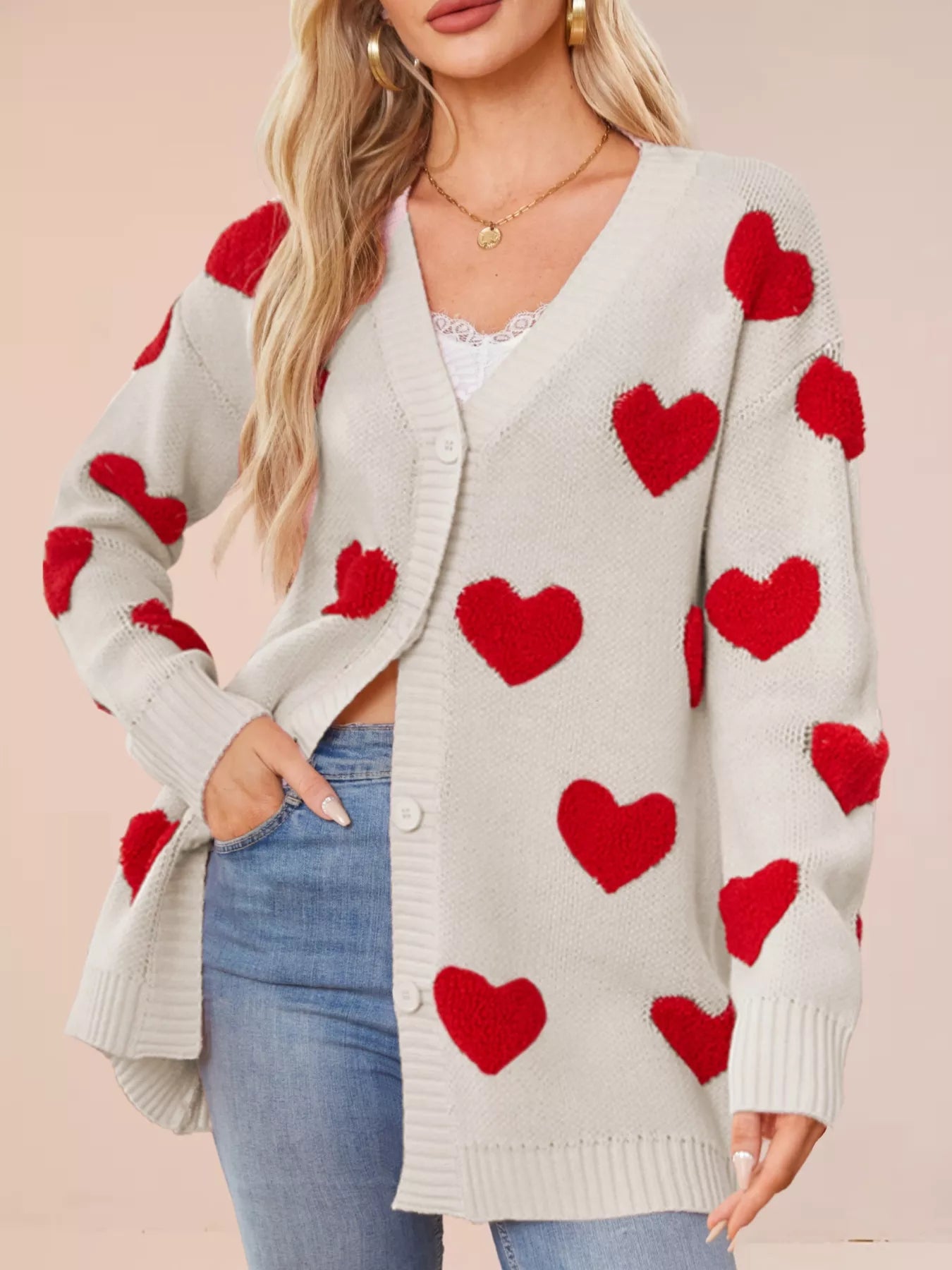 Heart Pattern Knit Button Up Cardigan for Women with red hearts on a light gray background.