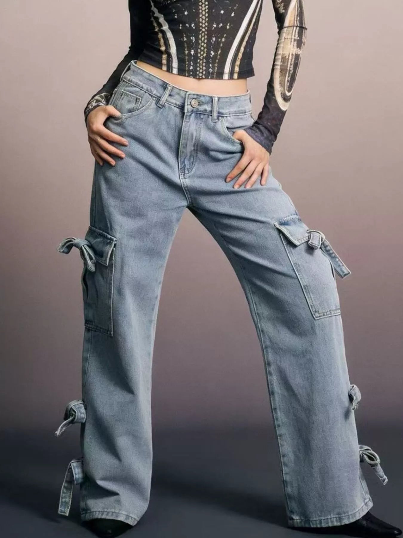 Bow Wide Leg Jeans with pocketed detail and relaxed fit, featuring stylish bow ties.