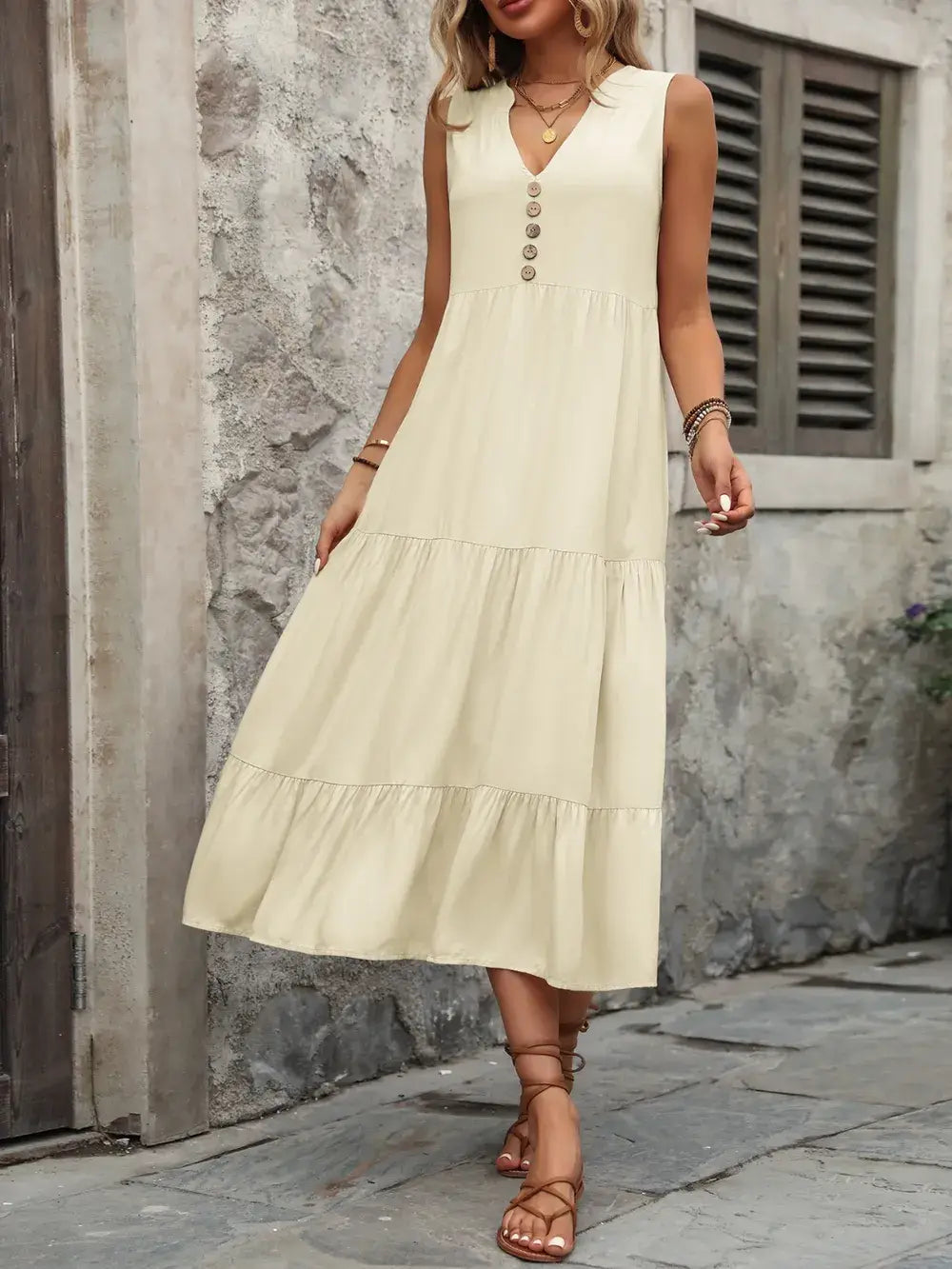 Ivy Lane Decorative Button Notched Sleeveless Dress in a soft yellow color with decorative buttons, perfect for casual wear.